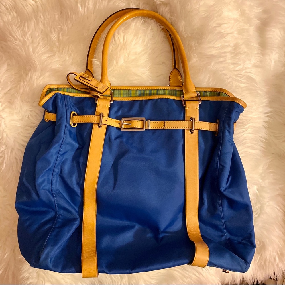 Blue and green Tumi tote with buckle